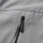 Close-up of gray jacket zip pocket with dark zipper pull | Chaps London