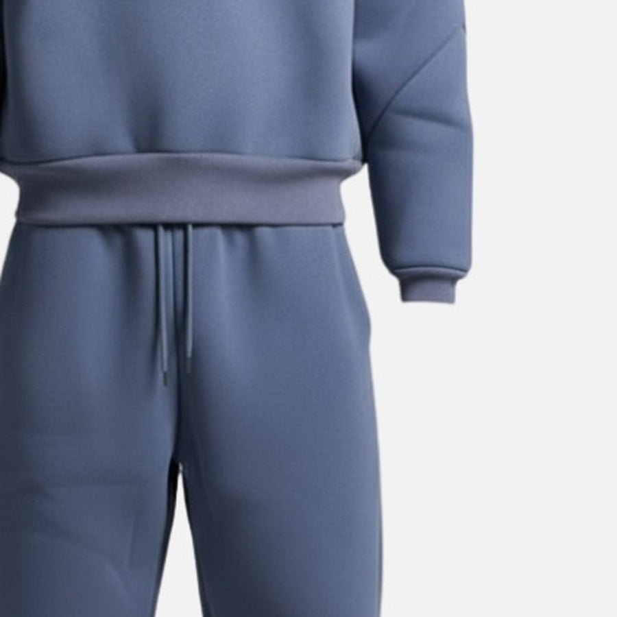 Slate blue hoodie tracksuit with drawstring joggers, worn by person, close-up | Chaps London