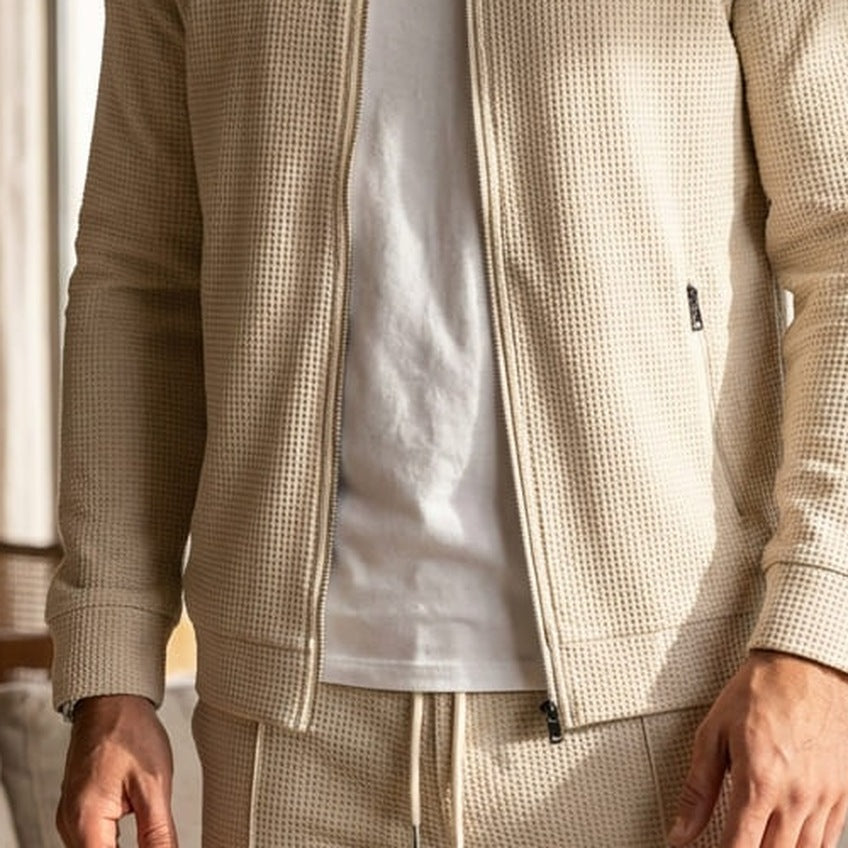 Beige waffle-texture zip jacket worn by man, paired with matching sweatpants | Chaps London