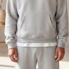 Gray hoodie with kangaroo pocket and matching joggers worn by man | Chaps London