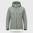 Gray hooded rain jacket with zip pockets, worn by a person | Chaps London