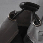 Gray jacket close-up showing metal grommets and black cord toggle detail | Chaps London
