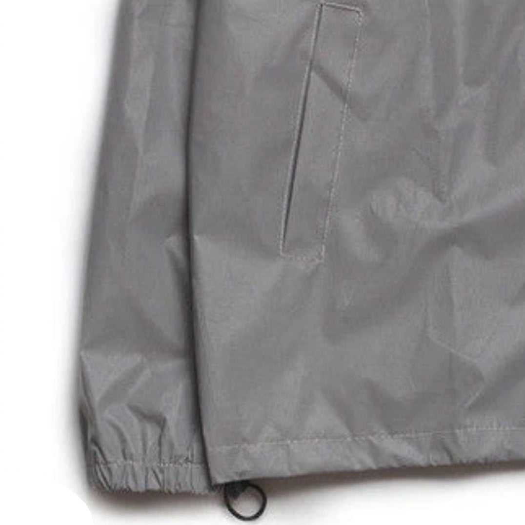 Gray waterproof jacket detail showing zippered pocket and elastic hem cord | Chaps London