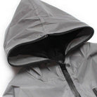 Gray waterproof rain jacket hood close-up with zipper, black interior lining visible | Chaps London