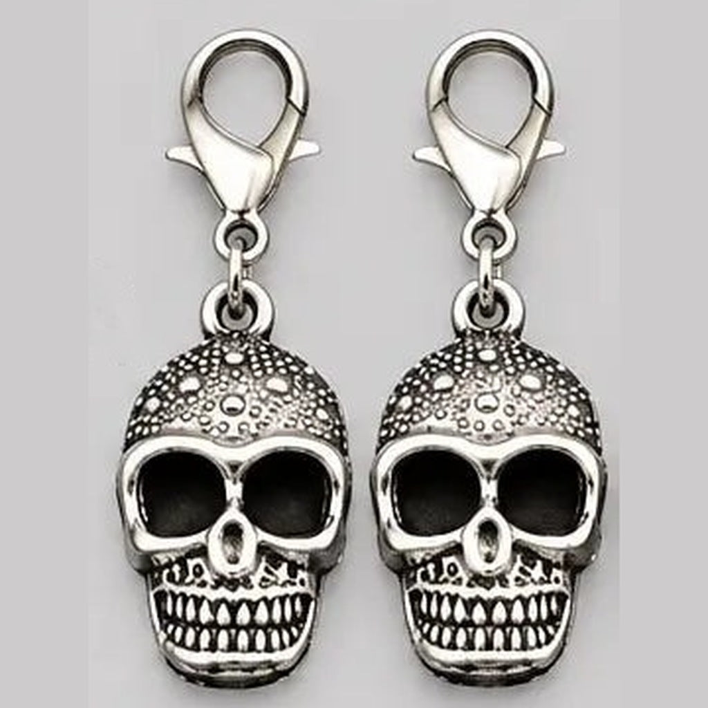 Two silver skull charms with lobster clasps, shown flat, decorative textured design | Chaps London