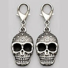 Two silver skull charms with lobster clasps, shown flat, decorative textured design | Chaps London