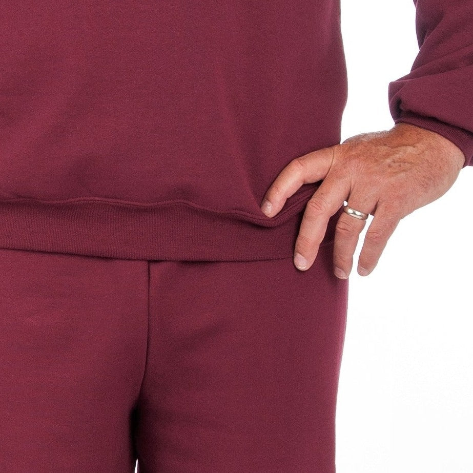 Maroon fleece sweatshirt and joggers worn by person, close-up waist view | Chaps London