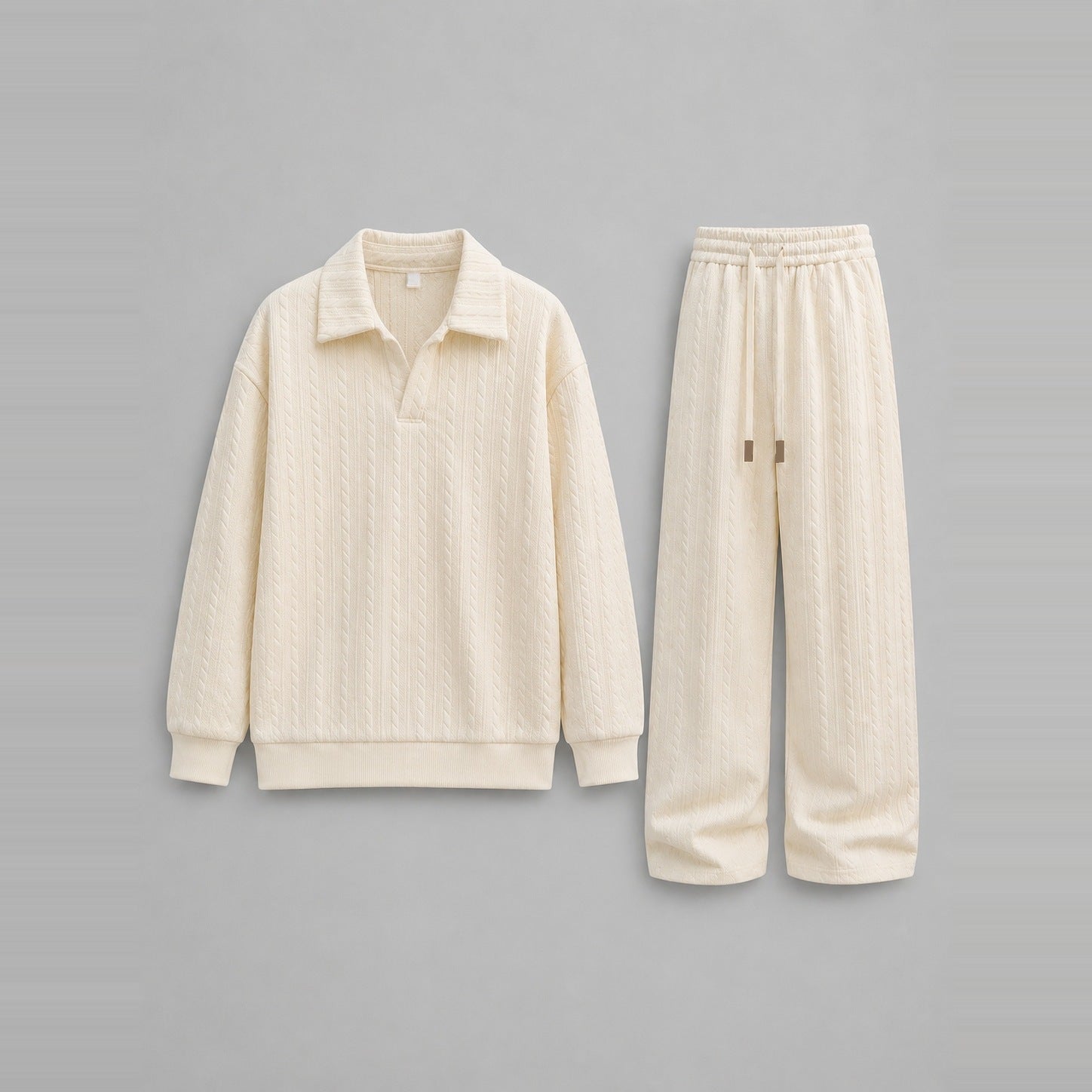Cream cable-textured collared sweatshirt and wide-leg trousers, laid flat | Chaps London