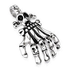 Skeleton hand pendant with skull and crossbones, flat lay, silver tone | Chaps London