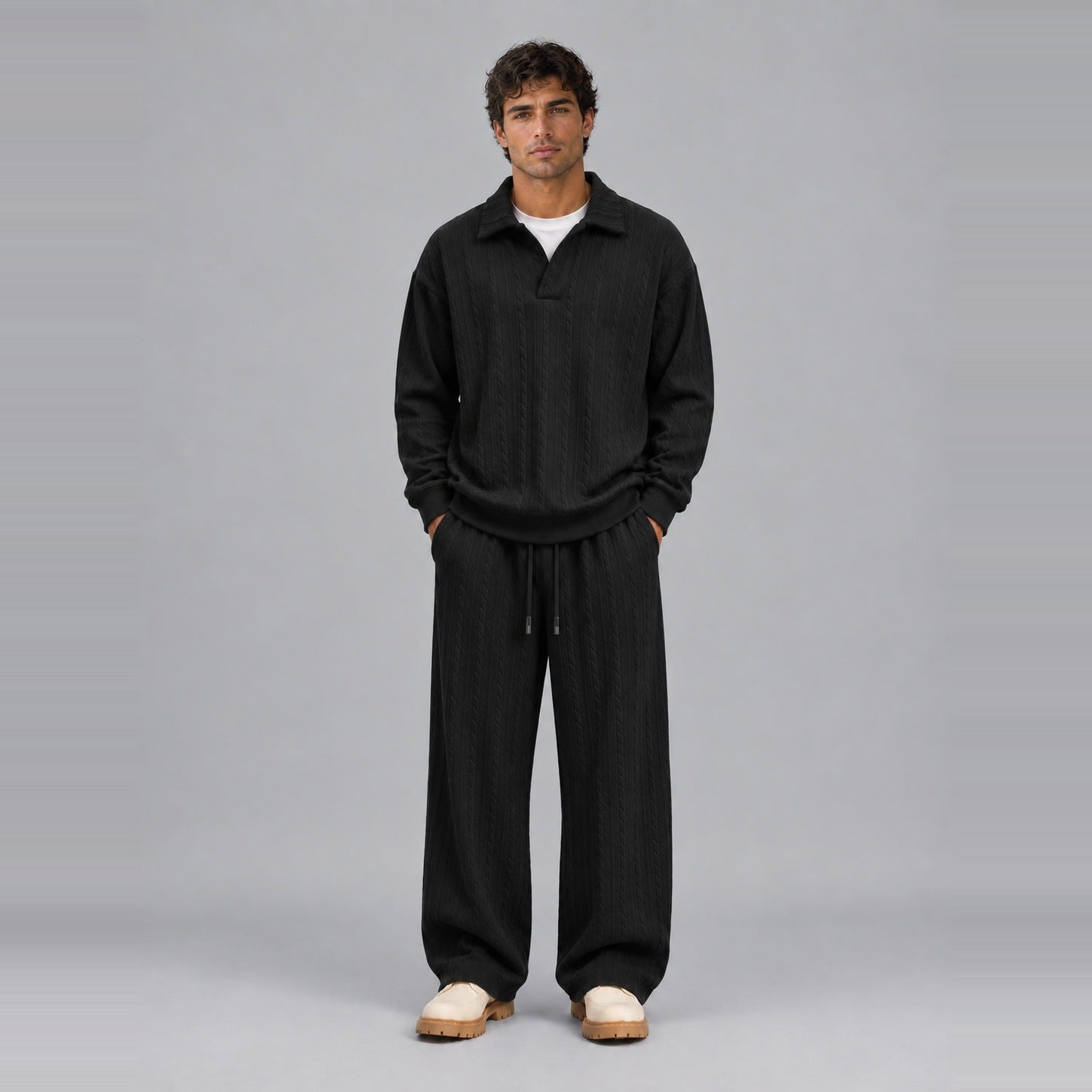 Man wearing black ribbed collared top and wide-leg trousers, full outfit | Chaps London