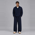 Man wearing navy textured collared sweatshirt and matching wide-leg trousers, full outfit | Chaps London
