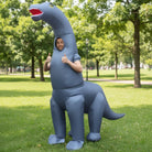 Man wearing gray inflatable long neck dinosaur costume, giving thumbs up outdoors | Chaps London
