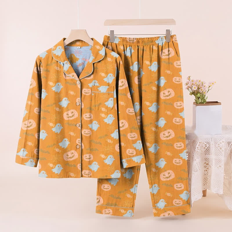 Orange pyjama set with ghost and pumpkin print, shown on hanger | Chaps London