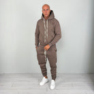 Man wearing brown hoodie tracksuit with cuffed joggers and white sneakers | Chaps London