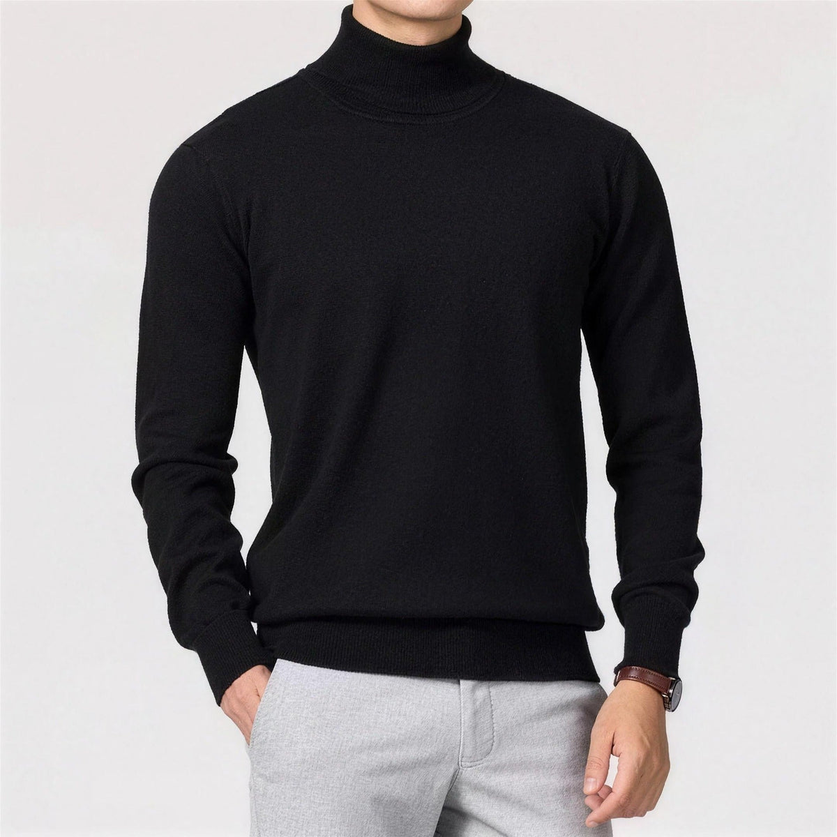 Black ribbed turtleneck sweater worn by man, paired with light gray trousers | Chaps London