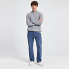 Man wearing grey half-zip jumper with blue denim jeans, worn full-length | Chaps London