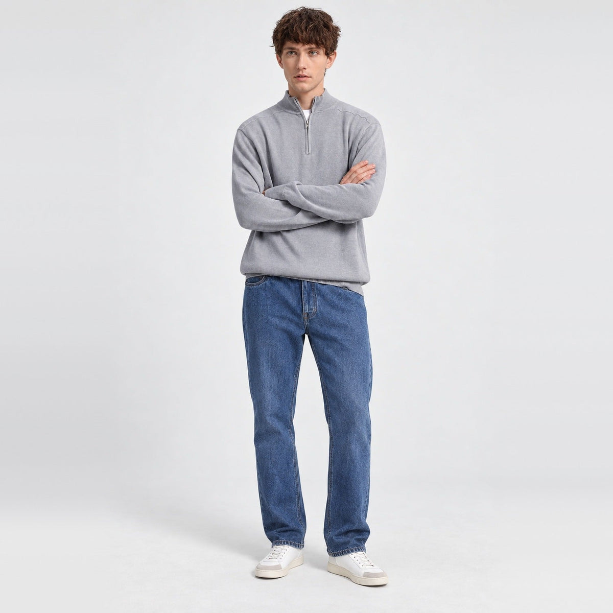 Man wearing grey half-zip jumper with blue denim jeans, worn full-length | Chaps London