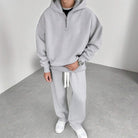 Man wearing grey half zip hoodie with matching wide leg joggers | Chaps London