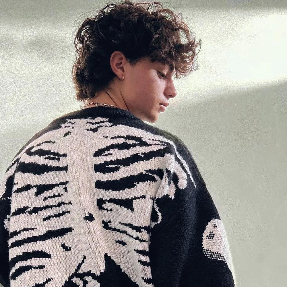 Man wearing black and white skeleton knit sweater, ribcage design on back | Chaps London