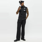 Man wearing black police costume with sleeveless shirt, hat, and badge | Chaps London