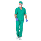 Man wearing green surgeon scrubs, cap, mask, and blue gloves, walking | Chaps London