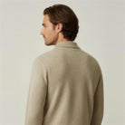 Man wearing beige textured knit polo jumper, shown from behind, worn | Chaps London