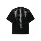 Black oversized t-shirt with spine skeleton print, shown flat, back view | Chaps London