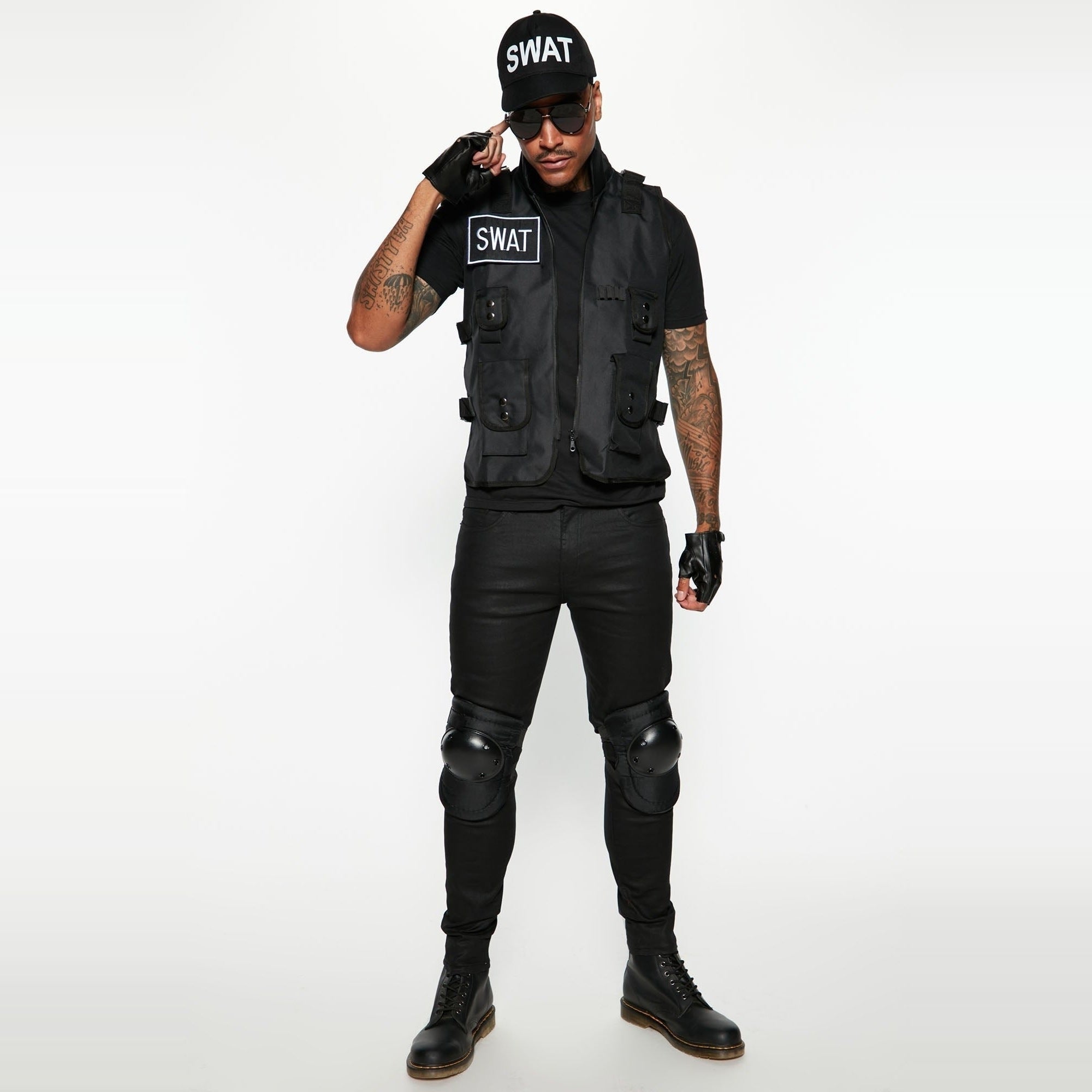 Man wearing black SWAT costume vest, cap, gloves and knee pads | Chaps London