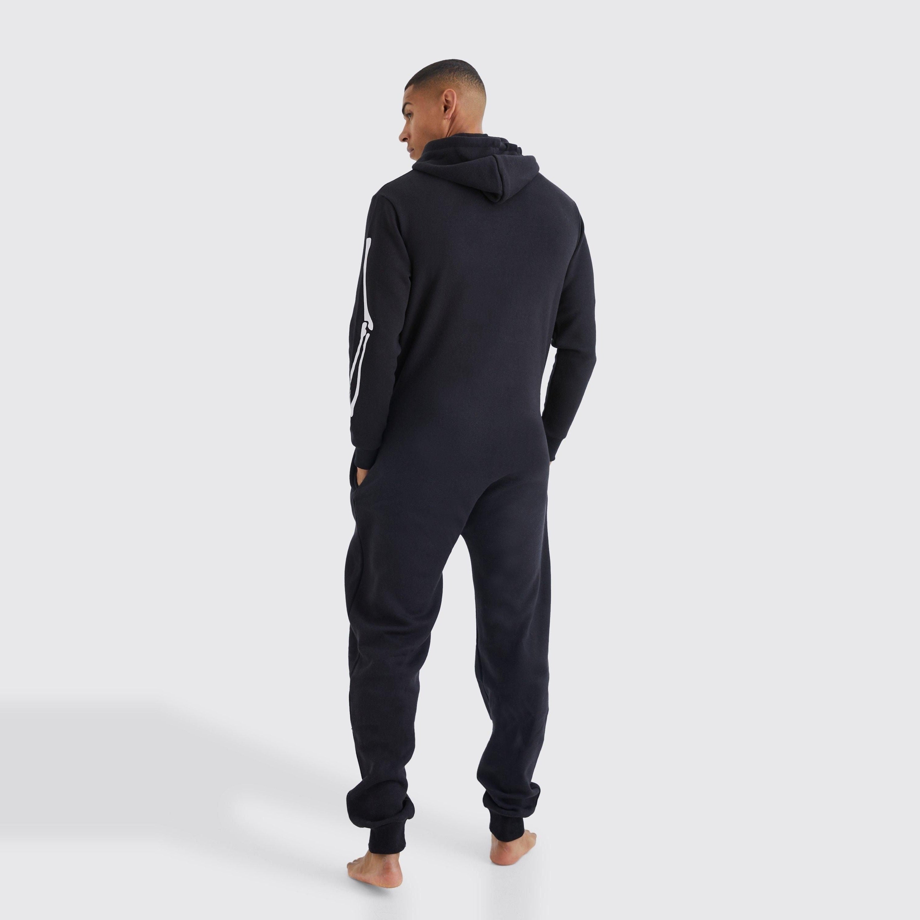 Man wearing black hooded onesie, rear view, with white sleeve stripe detail | Chaps London