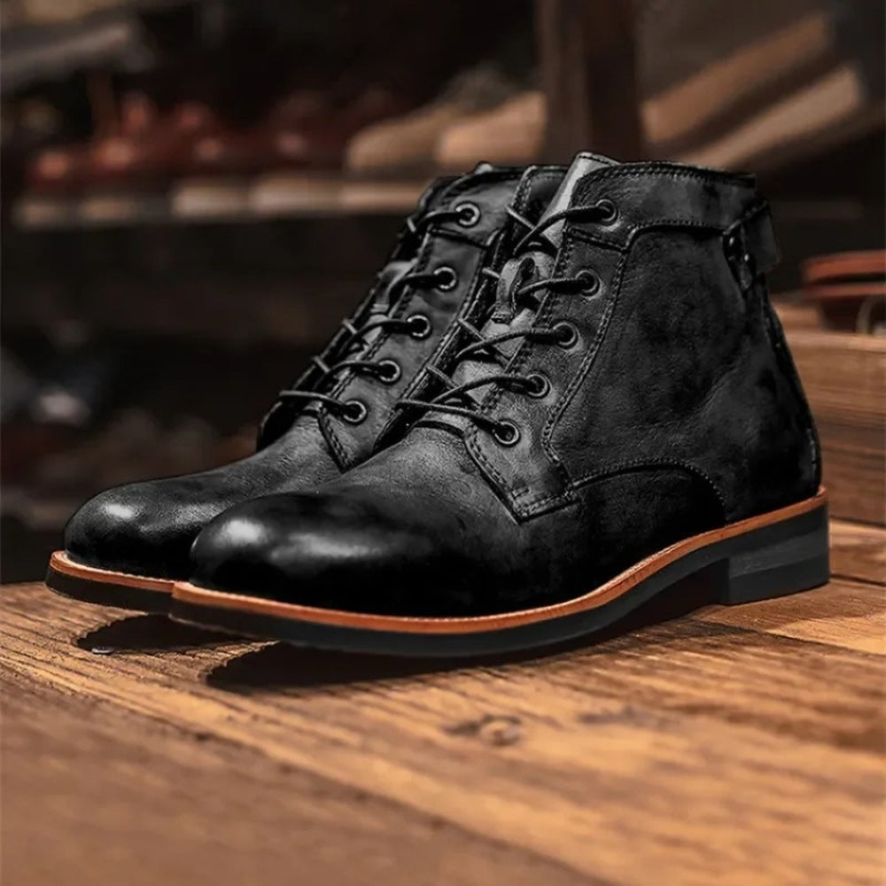 Black lace-up ankle boots with stacked heel, shown on wooden surface | Chaps London