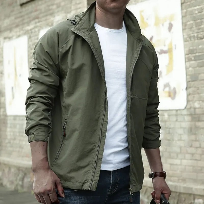 Olive green hooded jacket, unzipped, worn by man standing outdoors | Chaps London