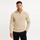 Man wearing beige waffle knit quarter zip jumper with navy trousers | Chaps London