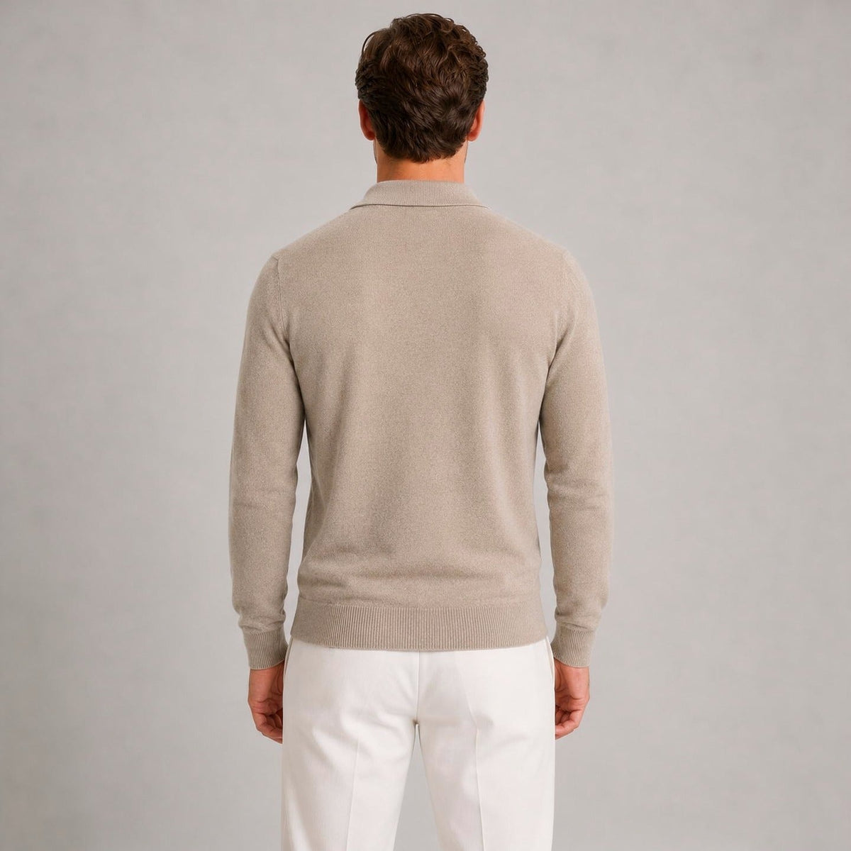 Man wearing beige quarter zip polo jumper, worn, rear view, white trousers | Chaps London