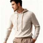 Man wearing beige knit hoodie with drawstring hood and tan trousers | Chaps London