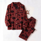 Red pyjama set with black pumpkin print, flat lay display | Chaps London