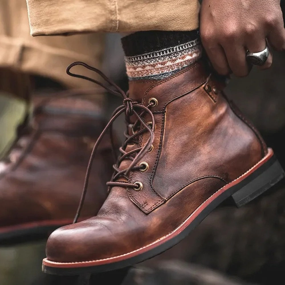 Brown lace-up ankle boots with stacked heel, worn by person | Chaps London