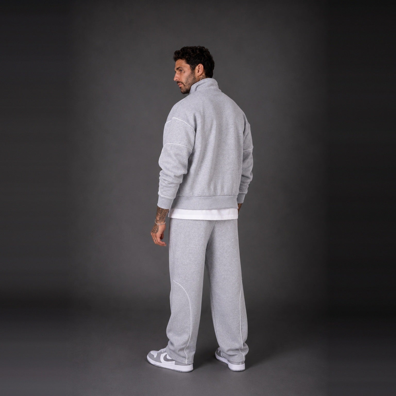 Man wearing light grey zip jacket and matching sweatpants, back view | Chaps London