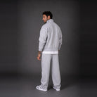 Man wearing light grey zip jacket and matching sweatpants, back view | Chaps London