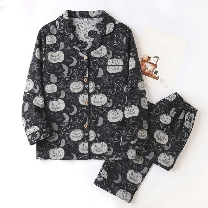 Black pajama set with pumpkin and moon print, laid flat | Chaps London