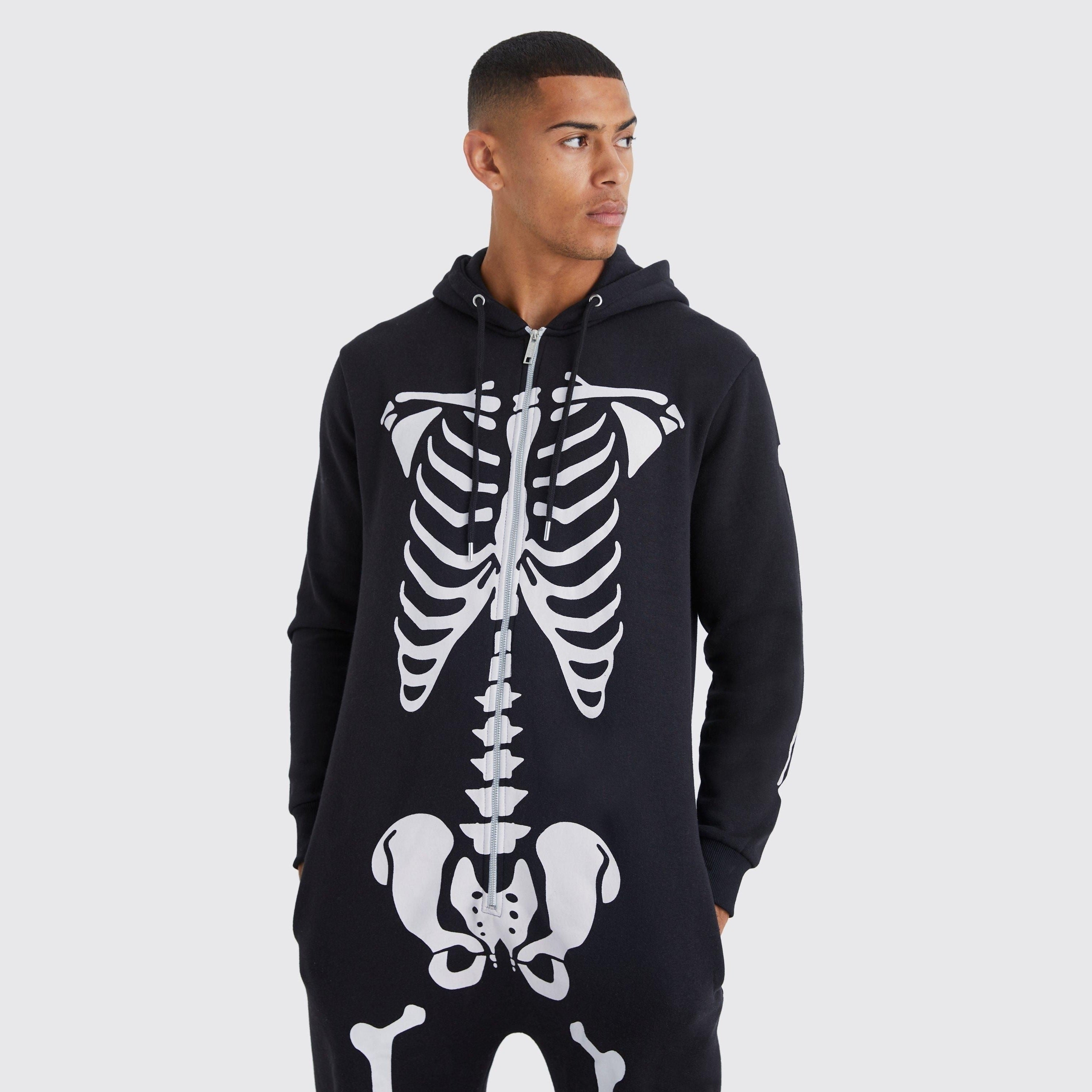 Man wearing black hooded onesie with white skeleton bone print design | Chaps London
