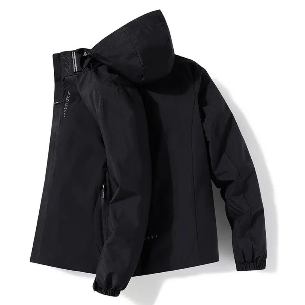 Black hooded hiking jacket laid flat, showing zippers and sleeve | Chaps London