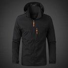 Black hooded windbreaker jacket with zip pockets, worn by a person | Chaps London