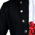 Black jacket with silver snap buttons over red patterned shirt, worn by person | Chaps London