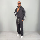 Man wearing grey striped half zip tracksuit with wide leg trousers | Chaps London