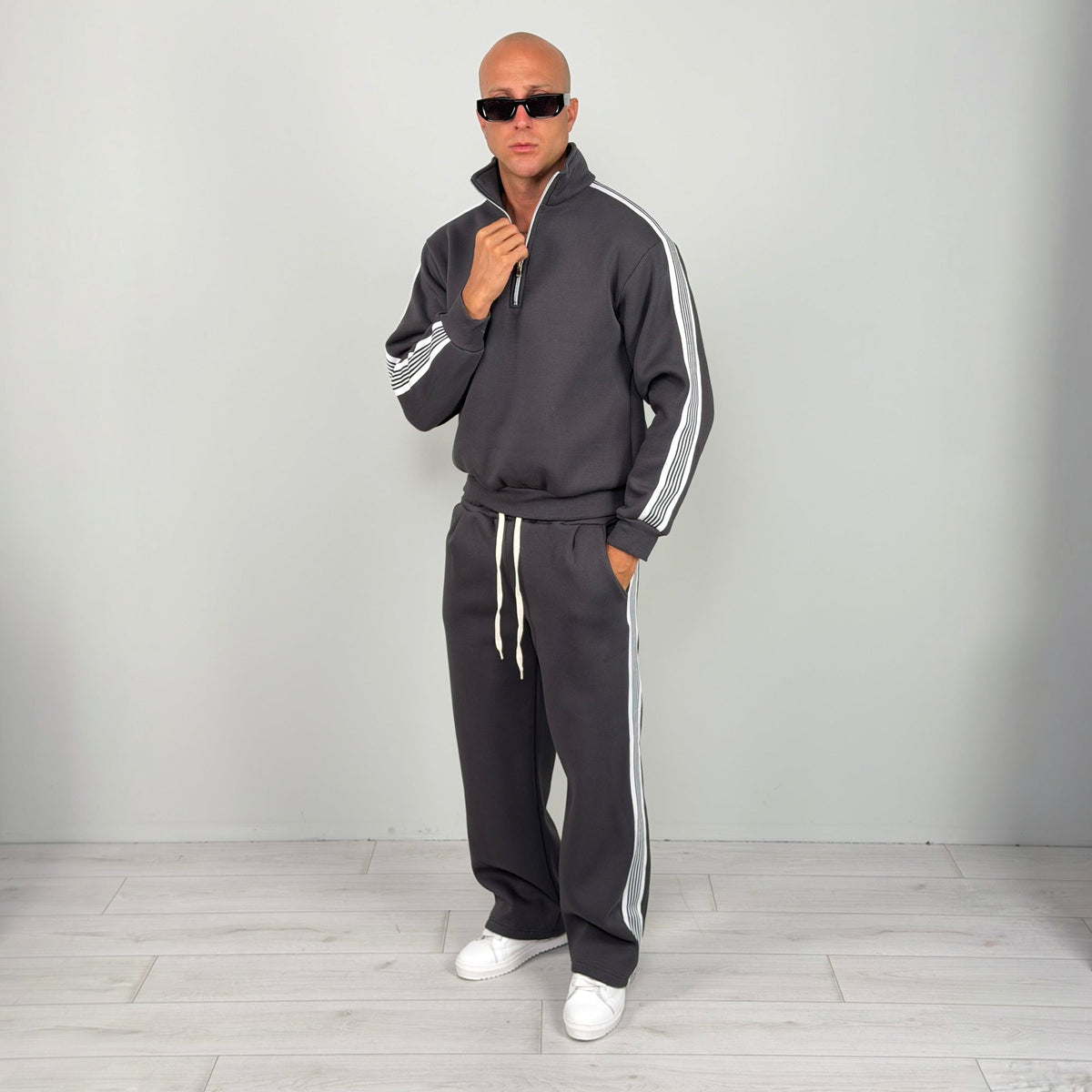Man wearing grey striped half zip tracksuit with wide leg trousers | Chaps London