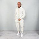 Man wearing cream hoodie and matching cuffed joggers with white sneakers | Chaps London