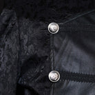 Close-up of black jacquard fabric with silver decorative buttons and trim | Chaps London