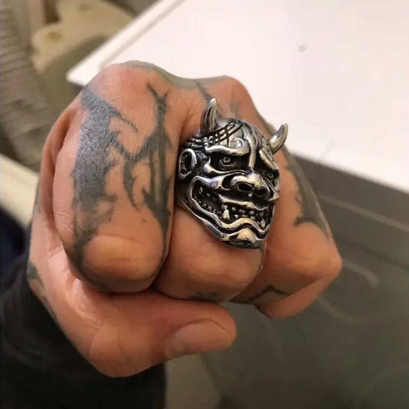 Silver Oni demon mask ring with horns worn on clenched fist | Chaps London