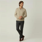 Man wearing beige knit quarter-zip polo sweater with dark trousers and brown shoes | Chaps London