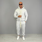 Man wearing grey marl hoodie and matching cuffed jogger tracksuit outdoors | Chaps London